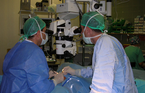 Photo in an eye surgery room showing a surgeon and assistant surgeon during cataract surgery